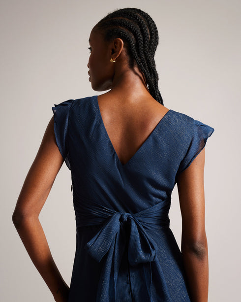 LAURAE-Dresses-LAURAE is a show-stopper. The metallic fibres and ruffle details are guaranteed to turn heads, while the bow tied back make it the perfect occasion piece. Maxi dress A-line Ruffle details Metallic fibres Bow tied back V-neck Sleeveless Awuoi is 5'10.5" / 1.79m and wears Dark Blue in a Ted size 1- Ted Baker Romania